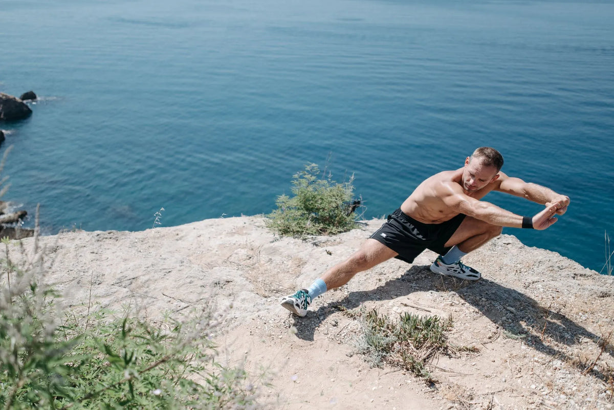 Man stretching before exercising outdoors