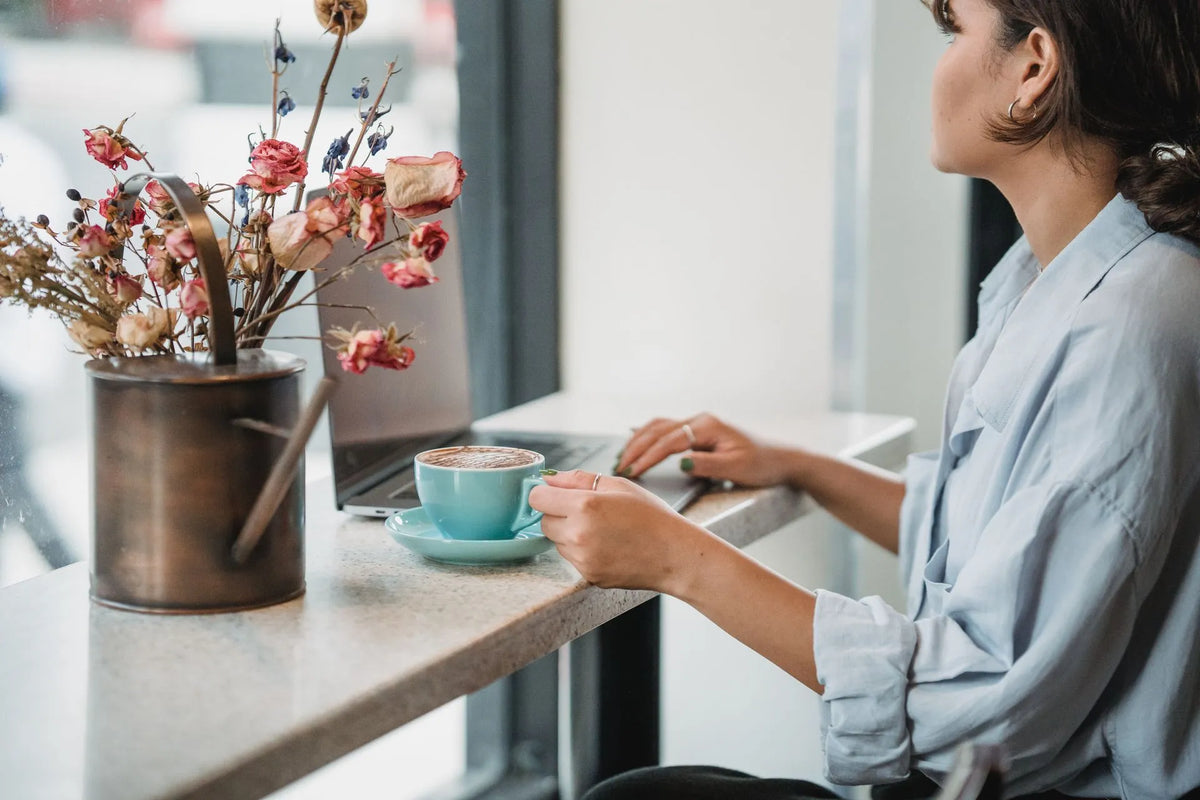 Woman setting aside coffee before hormone test