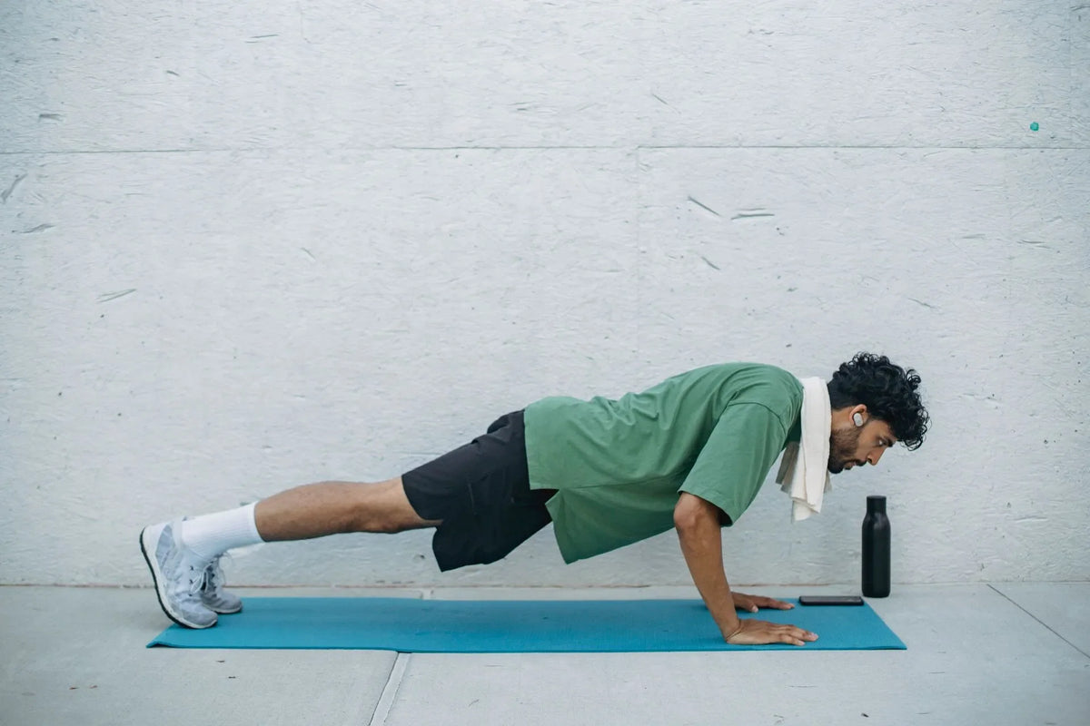 Man doing push-ups outdoors while on TRT